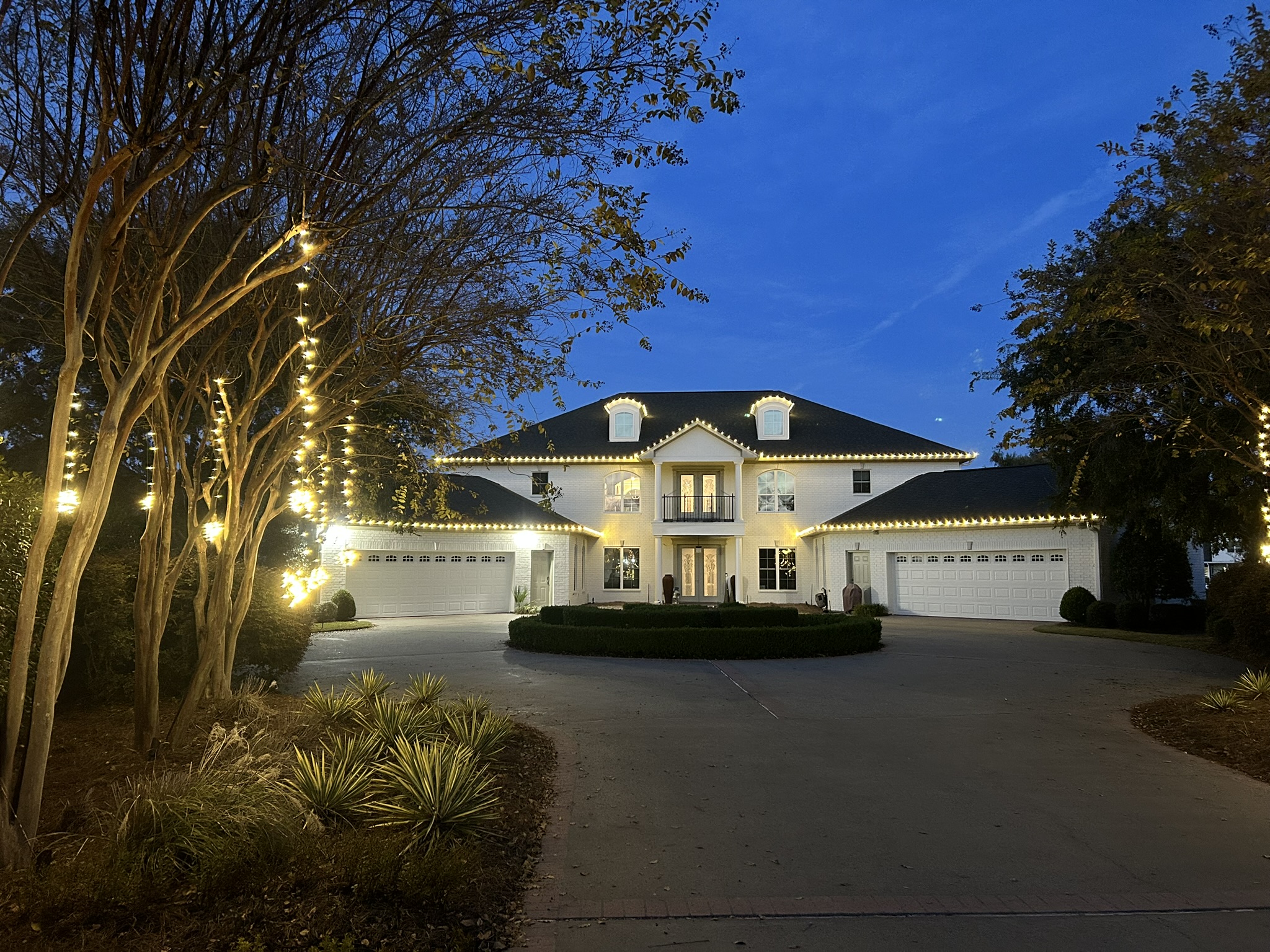 Holiday lighting installed on a home in the Raleigh area
